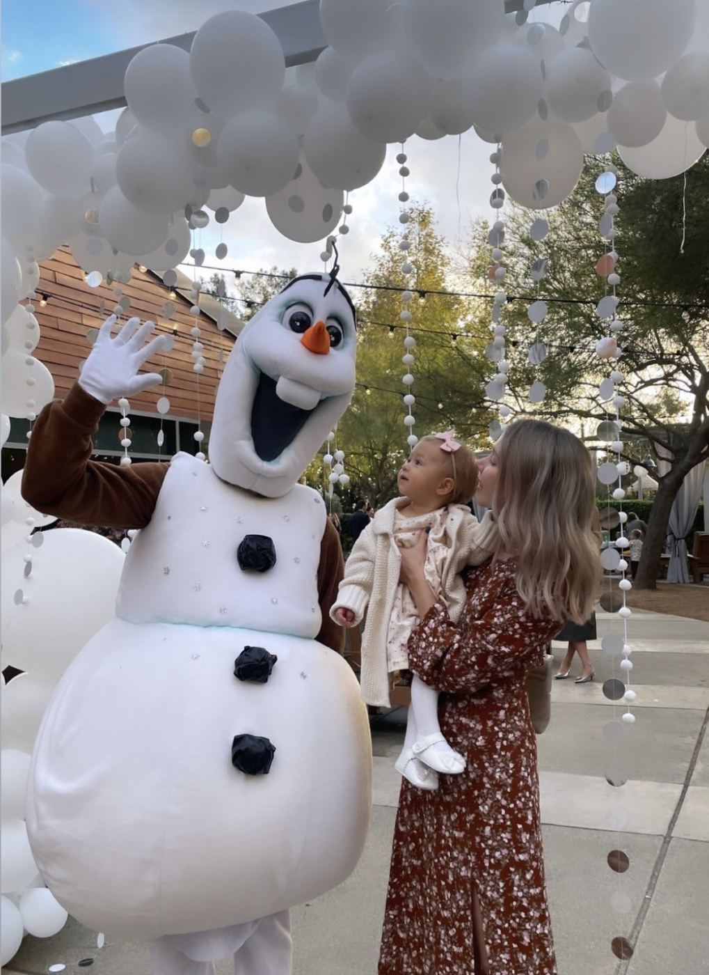 Frozen themed Olaf mascot with balloon garland